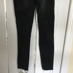 Black skinny distressed jeans.